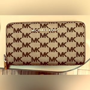 Authentic Michael Kors wallet. Tan/dark brown. Perfect size for handbags